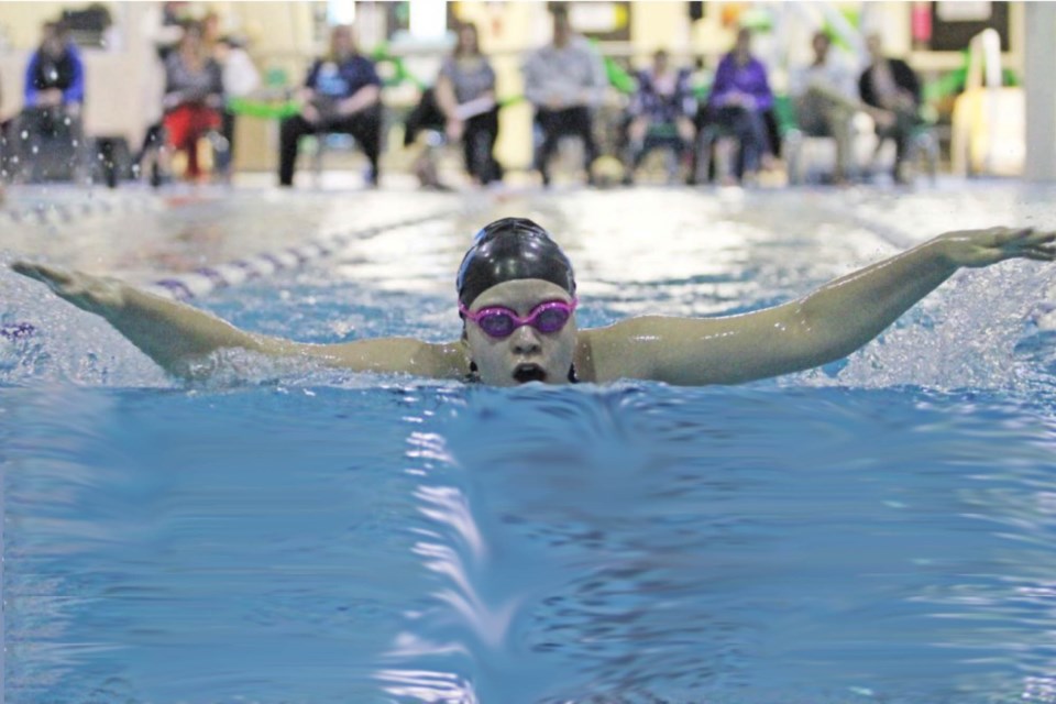 Whitecaps swim team member Hanah Shulz at a recent swim-a-thon at Lac La Biche's Portage Pool. The existing aquatic centre's pool is too short to host official swim meets. A new pool would attract swim events from around the province.      Image Rob 