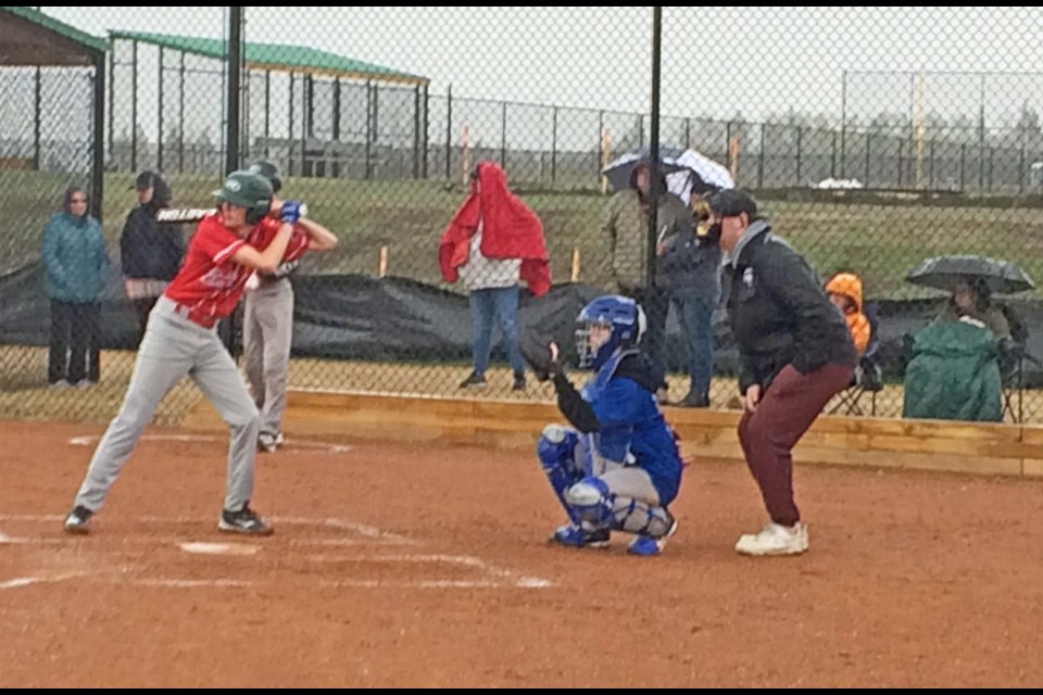 Swinging in the rain — Umbrellas and jackets were needed for fans of Wednesday night's rainy game between Lac La Biche and Bonnyville at the Bold Center Sports fields.