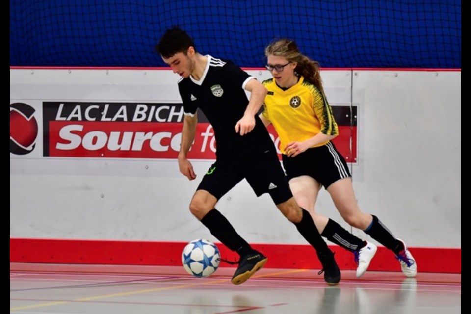 Lac La Biche U-17 mixed team player, and Lakeland U-17 girls team member Chloe Gauthier Schaub chases down a Bonnyville player during a recent home game.
