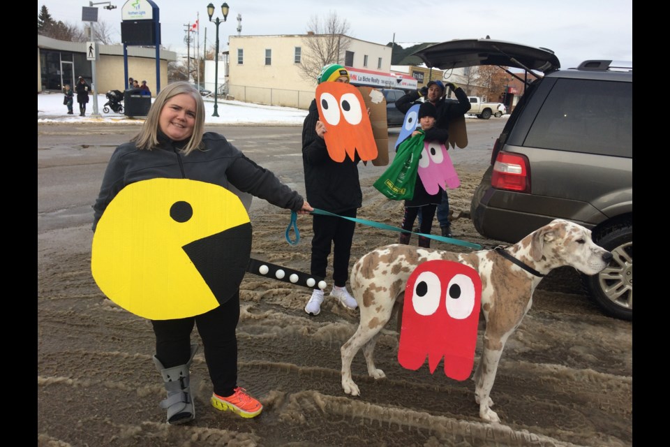 Lac La Biche's Finnestadt family was all Pac-d and ready for a downtown trick-or-treat walk with their dog Duke.    Image Rob McKinley
