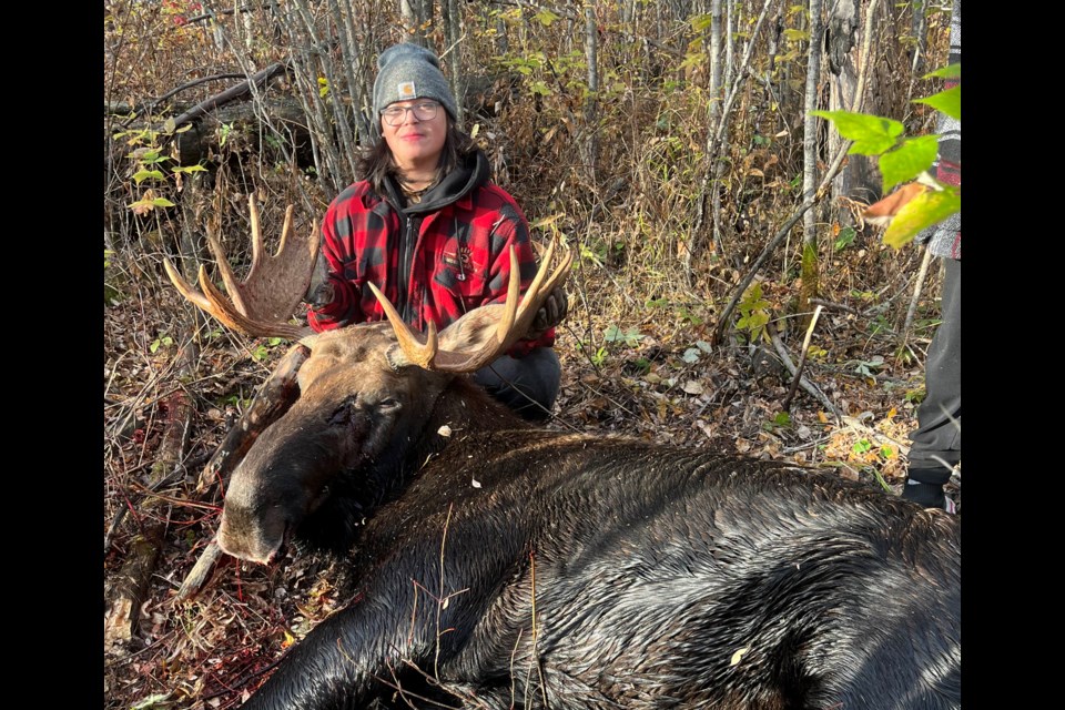 Teen camp hunter Graisen Lavallee with the moose he dropped on the camp's first morning.