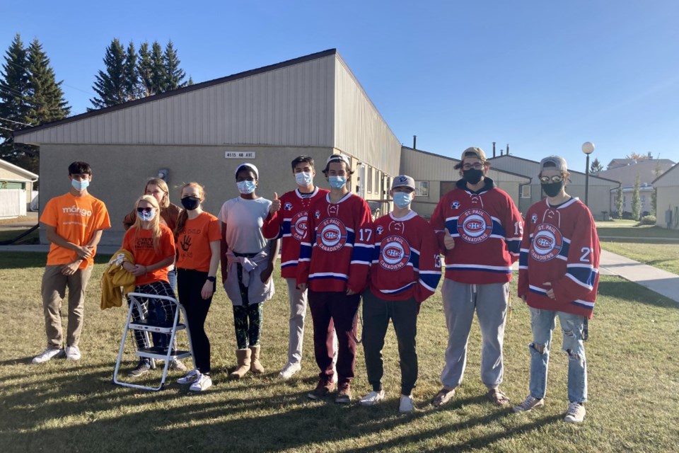 Five members of the St. Paul Jr. B Canadiens and five members of the Youth Council helped clean windows at Heritage Homes Phase II, Sept. 29.