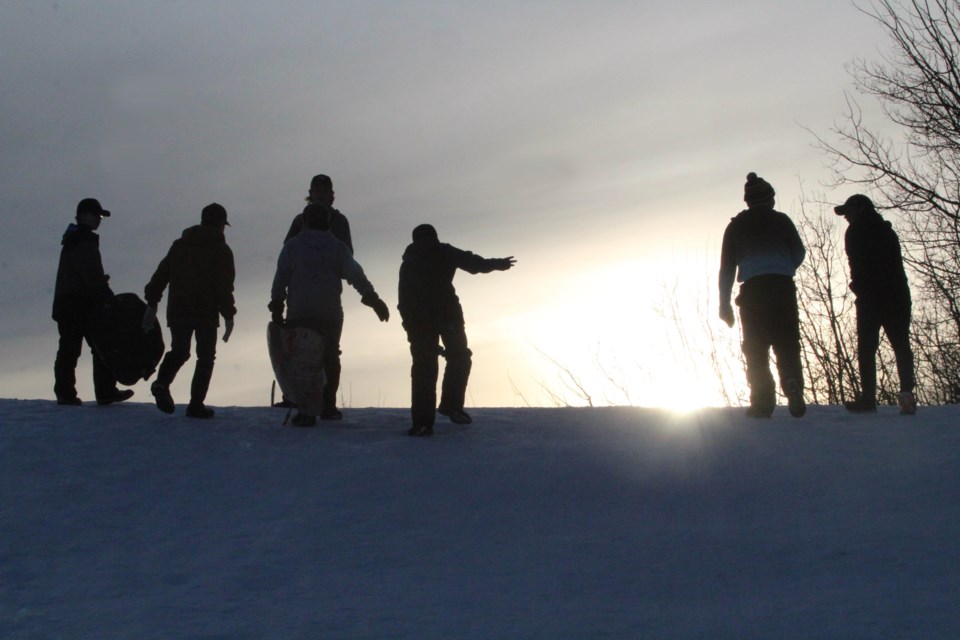 A group of youngsters enjoy a late afternoon of socially-distanced fun on the Alexander Hamilton toboggan hill. 
 The activity was part of an outdoor Teen Chill Zone event hosted by Lac La Biche's FCSS department on Thursday and Friday.   Image Rob McKinley