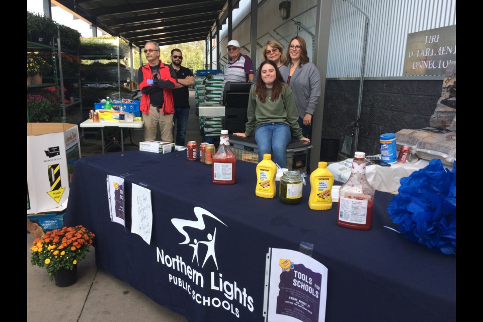 Community members, as well as Northern Lights Public Schools staff and even a student helped to raise money for the NLPS Tools For Schools Program on Friday at Britton's Independent Grocer.  The $5 burger and pop special at the Lac La Biche grocery store raised funds for the back-to-school program. Funds raised through the program go towards helping students in need from across the school division with supplies for the coming school year. Donations for the program can be made at Britton's Your Independent Grocer and The Rustic Bean coffee shop in the Bold Center.