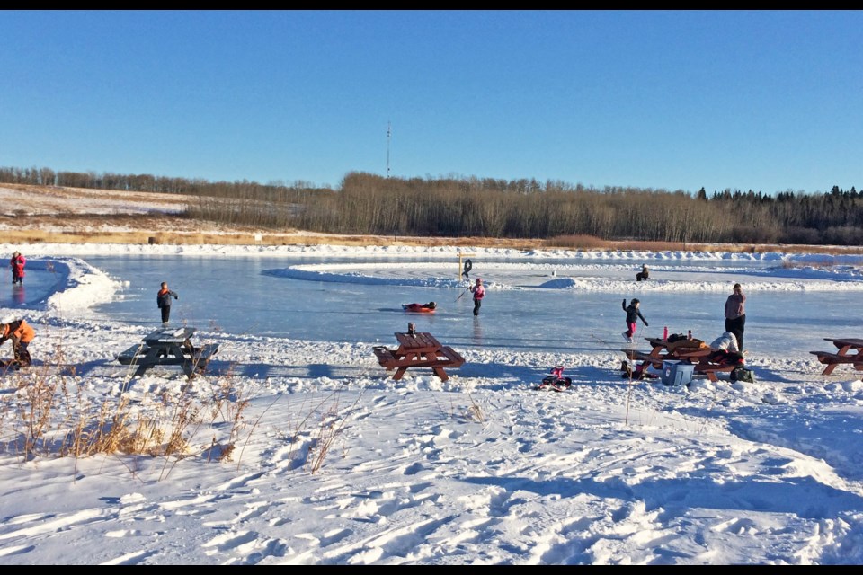 The Alexander Hamilton Trout Pond in Lac La Biche was a busy place last weekend, as blue skies and warmer temperatures drew families outdoors. Despite the activity, there was lots of room for social distancing on the ice and surrounding toboggan hills.
Changes to the provincial COVID-19 restrictions were reduced on Monday, allowing for socially-distanced, outdoor gatherings of up to 10 people. Outdoor gatherings of any size had been restricted since early last December.       Image Rob McKinley
