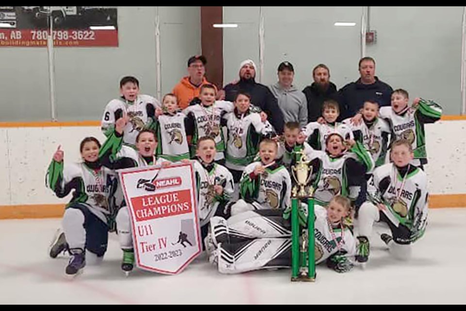 The Plamondon Cougars U11 team celebrates their recent Tier 4 league championship.