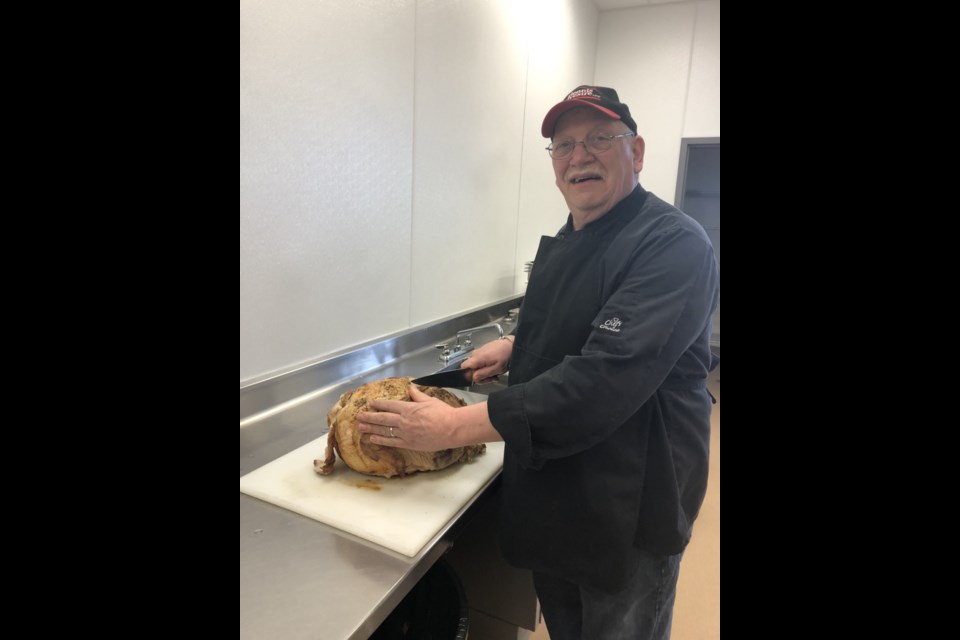 Chef John Dolan prepares some of the food at the JAWS commercial kitchen that is being distributed each week to more than 160 local families.