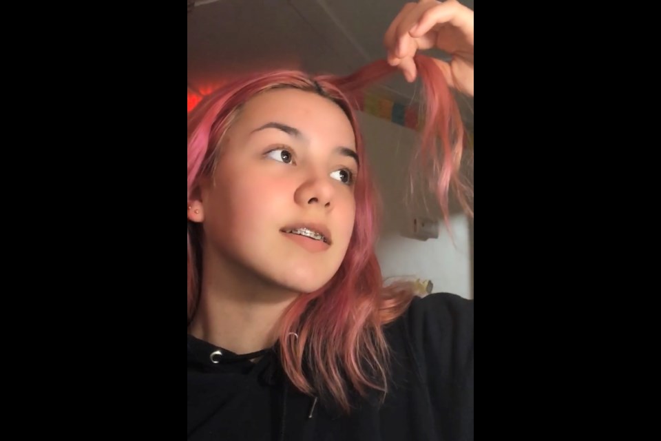 Lauren Grace Best looks at her pink-coloured hair in the days leading up to a charity shave to raise funds for the Road To Hope organization. Best, 15,  has set up a GoFundMe site with a goal of $1500 for the regional charity.