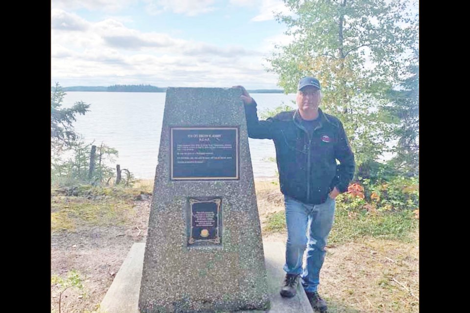 Vic Toutant last week  with the repaired Airmen's Memorial Cairn for Waskatenau-based RCAF pilot Erlyn Kirby.     Image Supplied