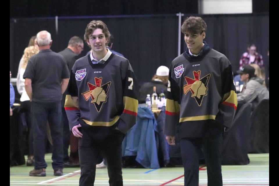 Bonnyville Pontiacs Jr. A players Liam Cavan (left) and Josh Simpson (right) also paid respects to Ringuette. / Mario Cabradilla photo