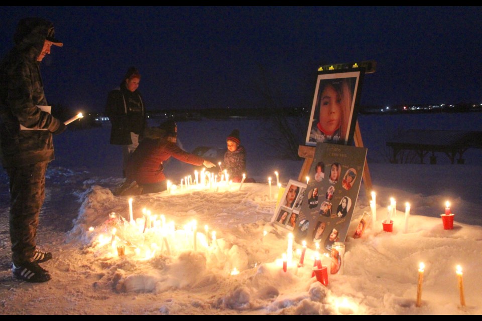 A photo display of 21 year old Tytiana Janvier is lit by hundreds of candles during one of the recent vigils for the Lac La Biche woman. Family say her body was found inside a Lac La Biche home last Thursday. Police have yet to release a cause of death in the case.
