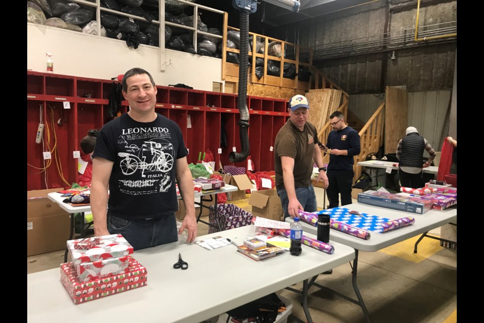 Firefighters' Society members and community volunteers helped to wrap more than 500 Christmas gifts for children this year at the local fire hall.