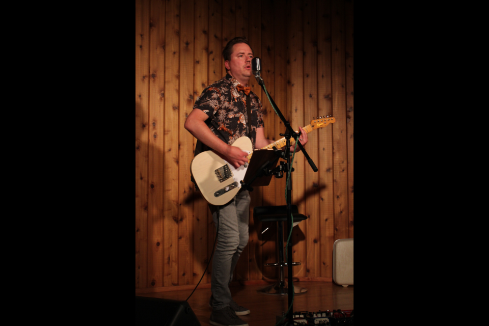 Singer-songwriter Dave Von Bieker performs  at the Churchill Park amphitheatre on Saturday. The performance in front of a crowd that filled the intimate venue is the latest in the Music in the Forest concert series.