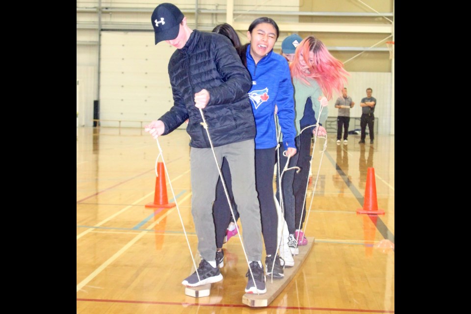 Making strides to the JAWS Cup — The team ski-walk was a tricky one to start. Teams found that laughter helped - so did coordination.