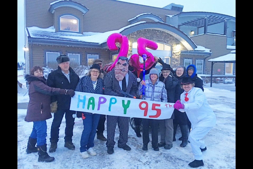 Friends of Wardene Whitford (in the grey jacket)  wanted to make sure the new 95 year old, and new resident at LacAlta Lodge had a fun birthday