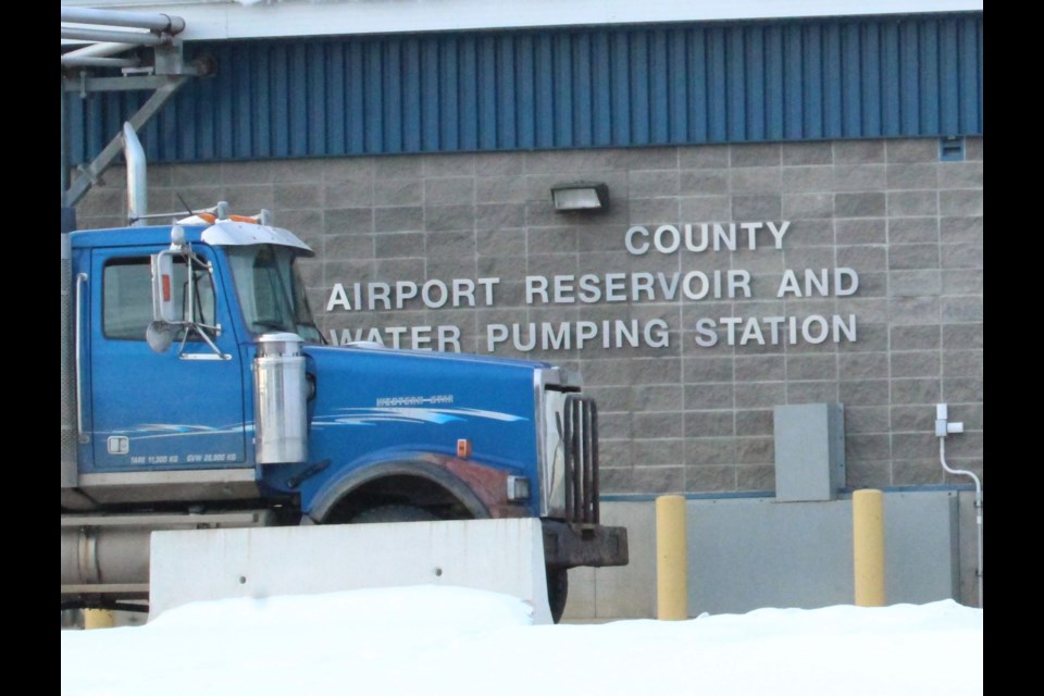 A commercial water tanker fills up at the airport truckfill last week.