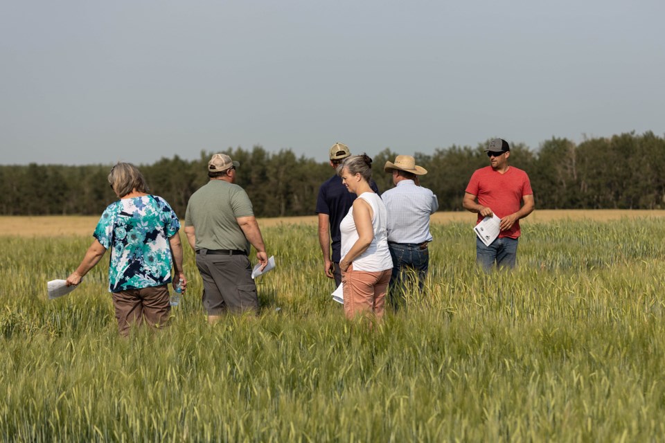 Participants and LARA representatives take part in a field tour along Highway 28, near Mallaig on Aug. 5.