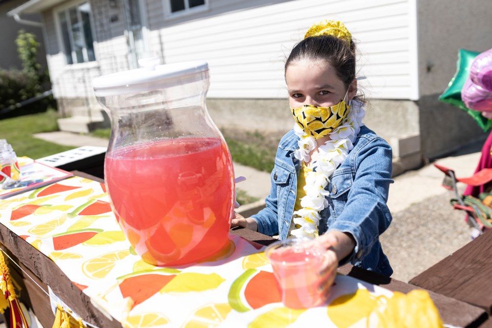 Molly Gratton serves up some pink lemonade. / Janice Huser photo