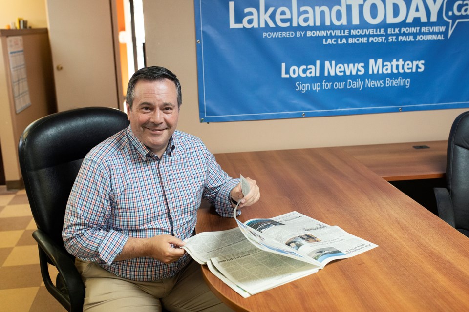 Premier Jason Kenney checks up on some local news after taking time to speak with Lakeland This Week, on Aug. 6 in Lac La Biche.  Janice Huser photo