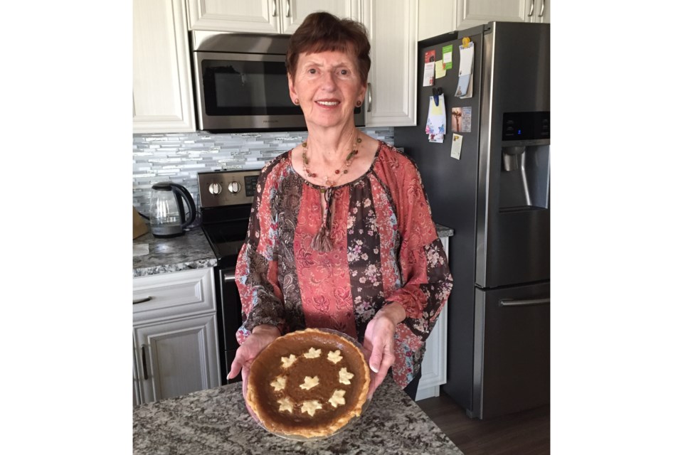 Albina Brousseau is pictured with a replica of her sugar pie dubbed the "best" in the province by ACFA on Oct. 14, in Edmonton.