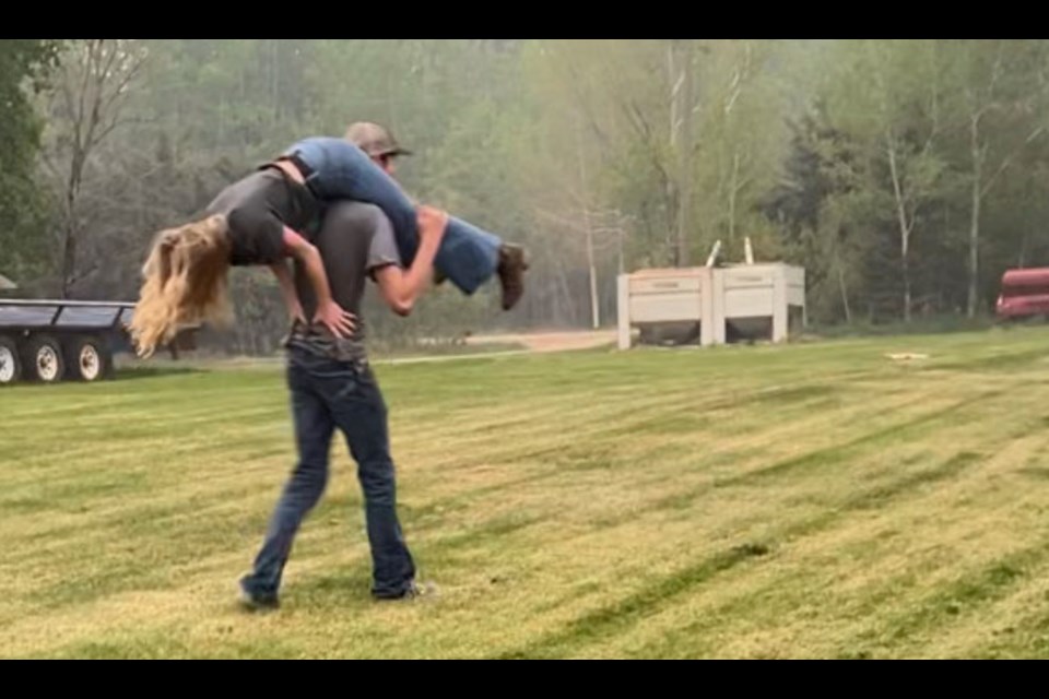 A screen grab from the Lac La Biche Agriculture Society and Farmers market social media page shows local couple Cora and Reece  practicing for the competition.