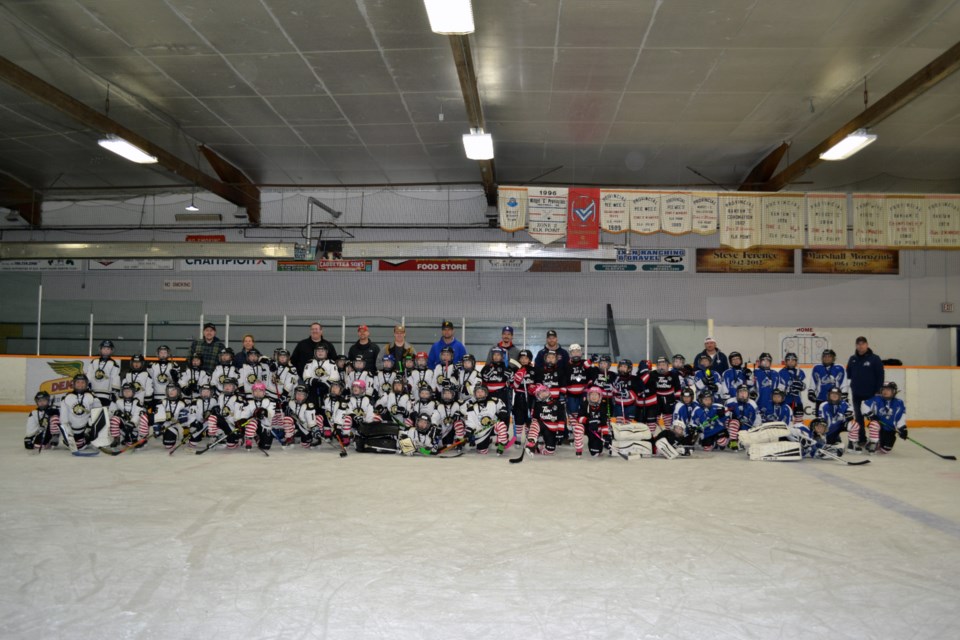 “You are all winners,” announcer Doug Bassett told Bonnyville Team Four, Bonnyville Team Five, Lac La Biche Clippers and Elk Point Avalanche as they all lined up for a group photo at the end of their Winterland Pool B competition at the A.G. Ross Arena, following a great two days of U9 competition. / Vicki Brooker photo