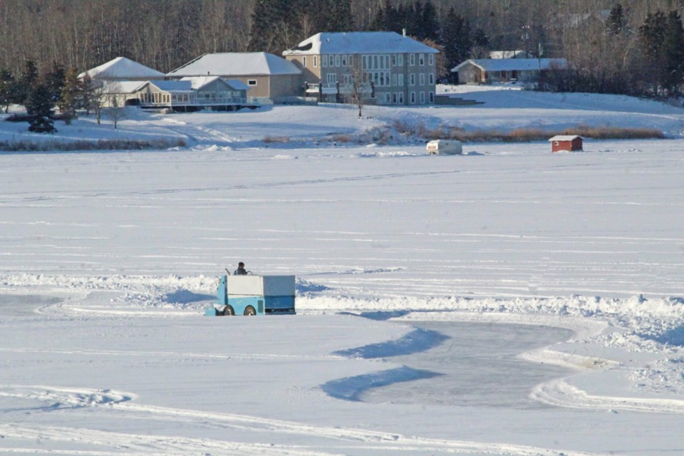 A Lac La Biche County staff member pilots a zamboni through a chicane section of the skating trail on the community's namesake lake.