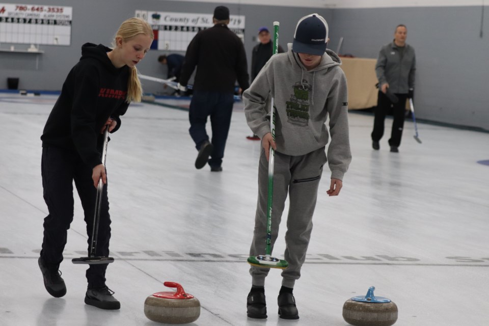 People of all ages enjoy a day of  curling at the St. Paul Curling Club's bonspiel fundraiser for Haying in the 30's on Nov. 19.