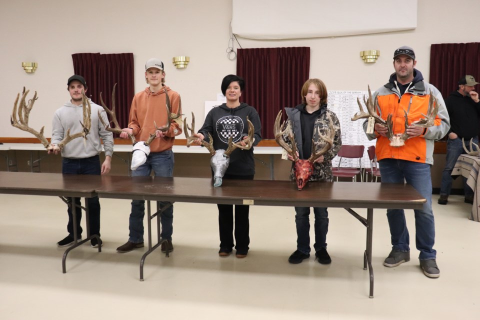Hunters display their winning racks. Pictured are Steven Ferleyko (far-left), Drew Andrashewski (middle-left), Crystal Anderson (middle), Rylee  Yadlowski (middle-right), and Shawn Wolgien.