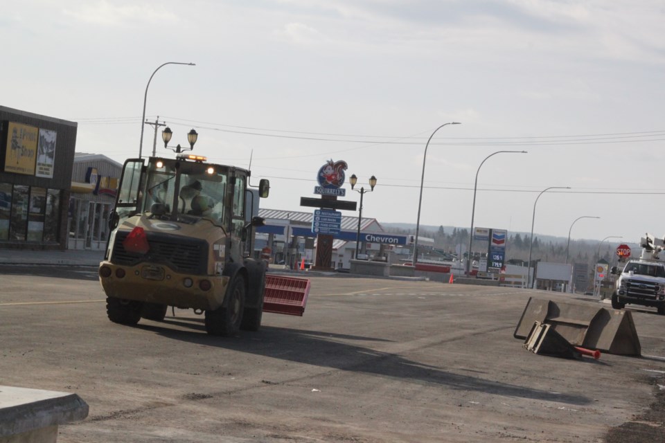 Open road. Construction equipment moves the last of the barricades along a one-block section of 101 Avenue in Lac La Biche on Tuesday afternoon. A few items, like streetlights, decorative trees and traffic lights at 103 Street will be installed at a later date. / Chris McGarry photo