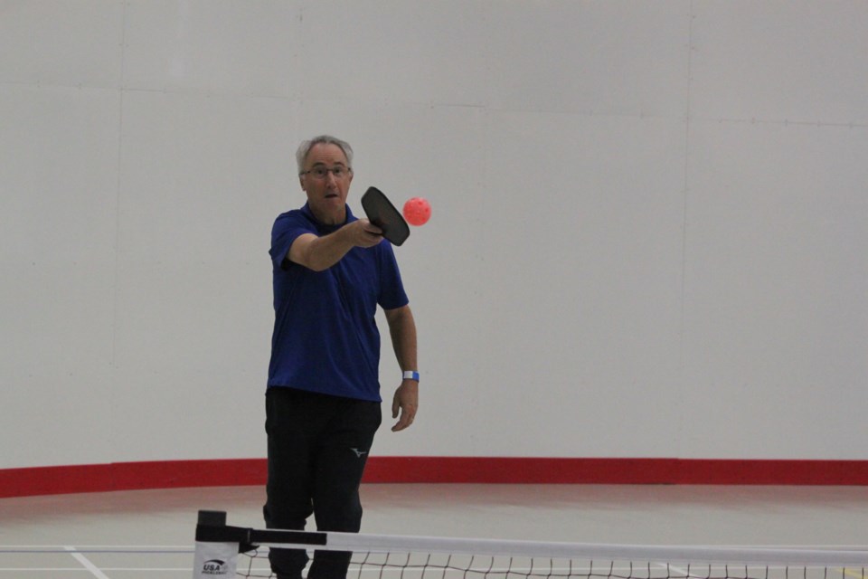 Blair Martin raises his paddle to strike the ball as it comes his way. Chris McGarry photo. 