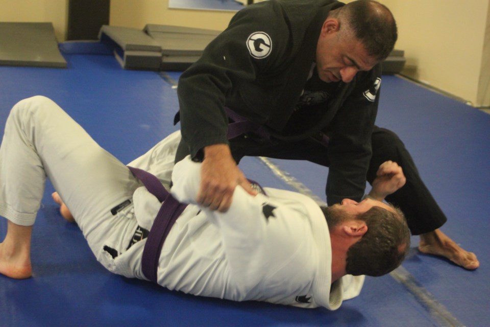 Mo Kabalan of Kabz Martial Arts demonstrates a technique with fellow Brazilian Jiu-Jitsu practitioner Greg Chiasson. The club is based out of the Bold Centre and holds classes three times a week. Chris McGarry photo. 