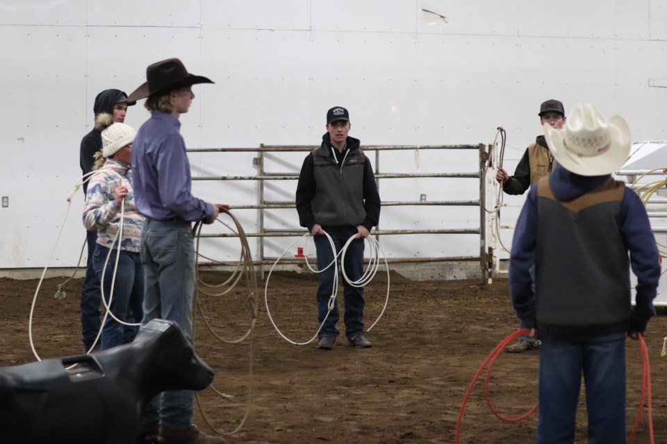 Clint Buhler provided roping instructions to participating youths at a roping clinic last weekend, Oct. 22, in St. Paul.