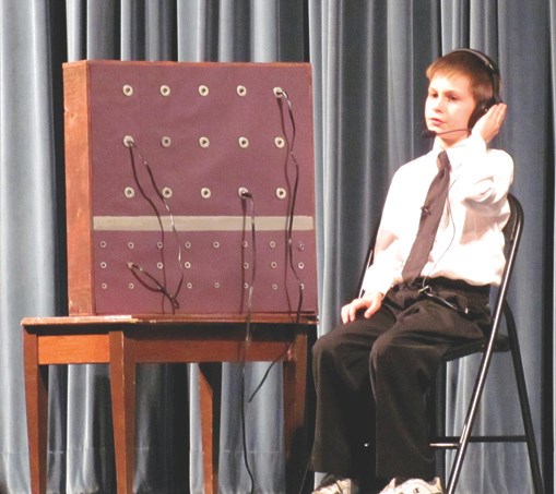 Austin Janz from Glendon School plays the telephone operator at the beginning of Act 2 in the drama club&#8217;s presentation of Ask Any Girl on April 23. Janz also played