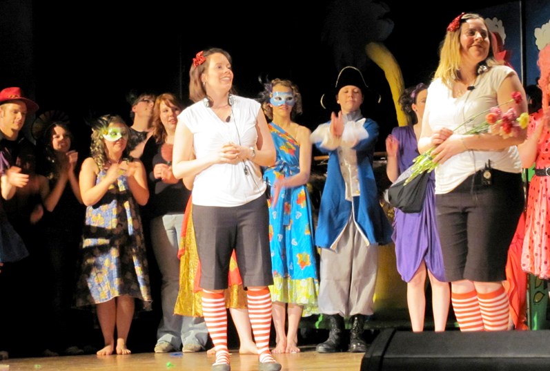 Co-directors Nathalie Reid (left) and Nicole Baker give flowers to the Grade 12 students working on and behind the scenes for the production of Seussical The Musical after