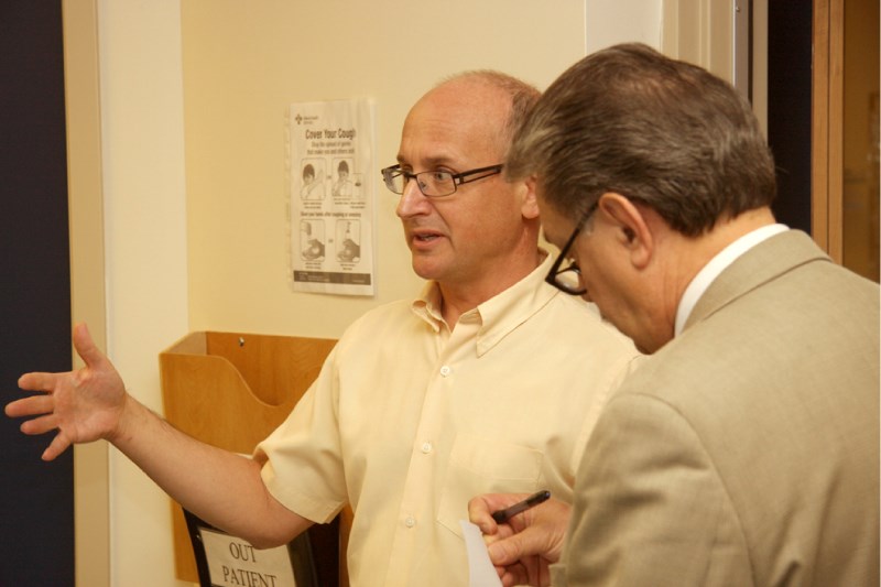 Dr. Guy Lamoureux, chief of staff at the Bonnyville Health Centre, explains a key point to Health Minister Gene Zwozdesky during a tour through the hospital on Friday.