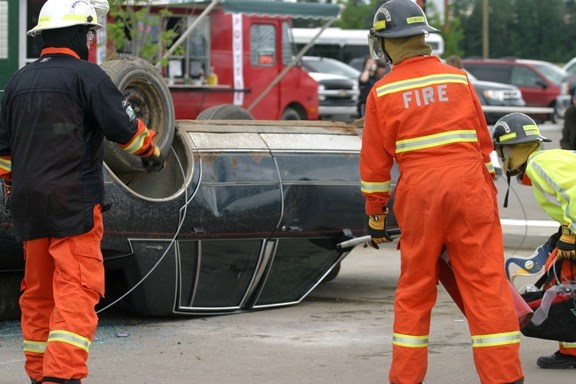 Incident Commander Tim Graham (left), Ethan Cronkhite, and Alicia Krawchuk approach the scene of a mock accident during the Alberta Regional Extrication Challenge in Cold