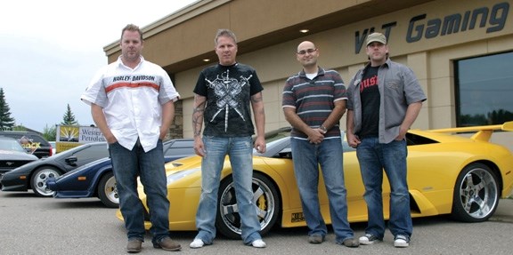 From left: drivers David Forrest, Greg Lacusta, Dream Wheels Weekend co-chair Sal Naim, and driver Doug Forrest before the bidding starts at the car ride auction at Players