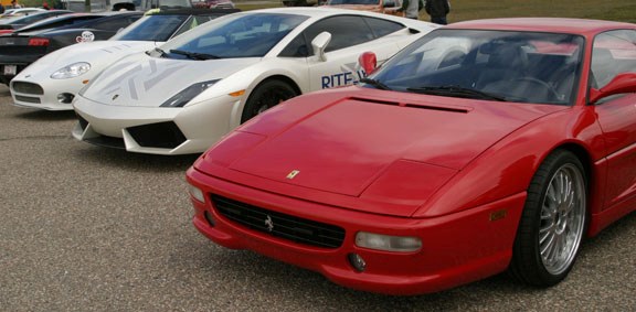 Cars line up at 4 Wing before drivers get their turn to reach top speed on the air base runway on Saturday.