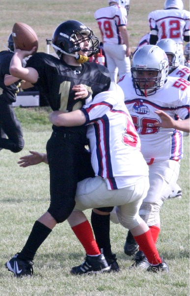 Two Bonnyville Bandits on the Royals quarterback take him down for the sack. The Bandits strong defence held the Royals to one touchdown in the second half of