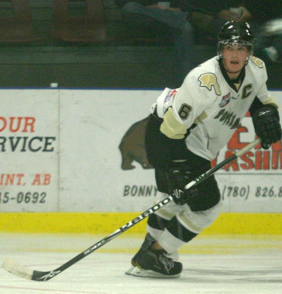 Pontiacs captain Michael Westfall patrols his zone against the Sherwood Park Crusaders Saturday. Westfall took a hit to the head later in the game that will keep him out of