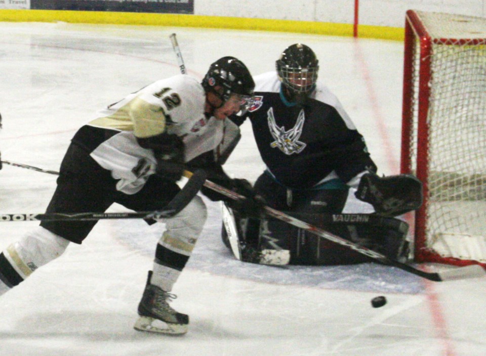 Pontiacs forward Brennan Volcan fights to get a shot on net during Friday&#8217;s win over the Canmore Eagles.