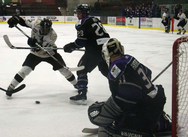 Pontiacs forward Kevin Carthy fights to get to the front of the net, during Saturday&#8217;s game against the St. Albert Steel. The Steel won the game in overtime.