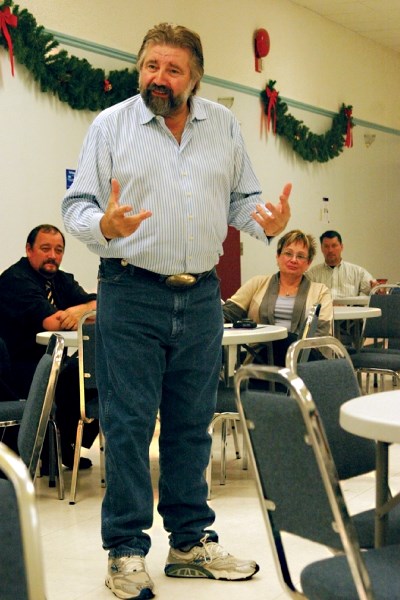 Minister of Infrastructure, Ray Danyluk, takes questions from PC party members at its constituency AGM on Thursday at the Seniors Centre. In the background is Treasury Board