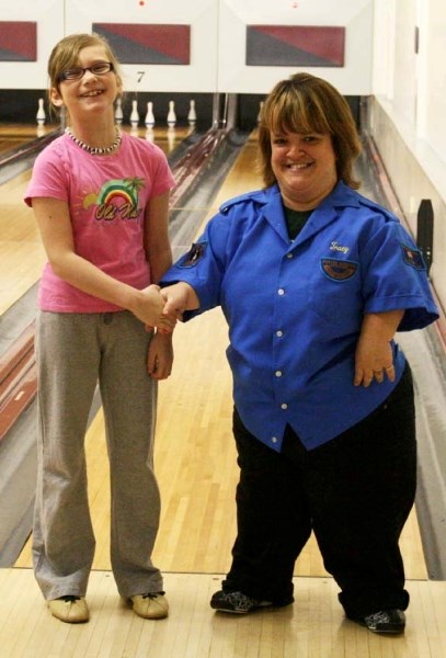Local bowler Kansas Johnson with her coach Tracy Martin.