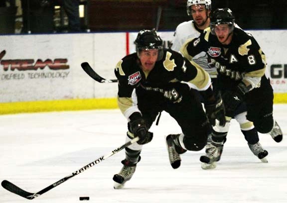 Pontiacs defenceman Nick Scott leads one of Bonnyville&#8217;s many rushes down the ice, with forward Devon Kalinski trailing not to far behind, during their shootout win