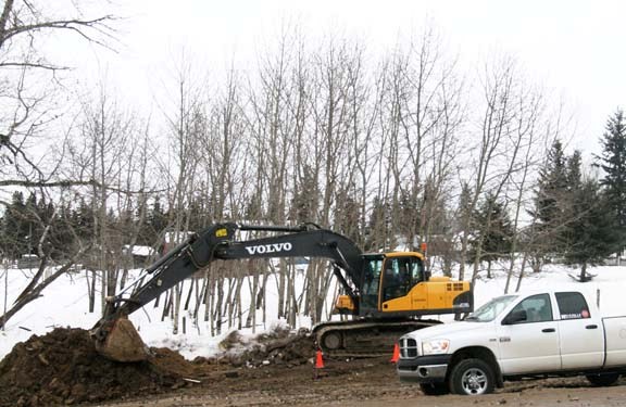 A crew cleans up a diesel spill Jan. 28, three km north of La Corey, that resulted from an accident involving a tanker transport truck and another vehicle on Jan. 5.