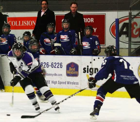 Kaley Herman of the Strathmore Rockies makes a nice move to the inside in an attempt to get around Chimos defenceman Meaghan Mikkelson at the game Sunday afternoon.