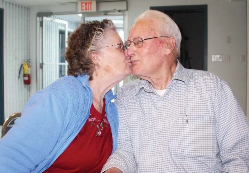 Lorane and Willy McGregor share a kiss at the Seniors Drop In Centre Feb. 2 after discussing their 63-year marriage.