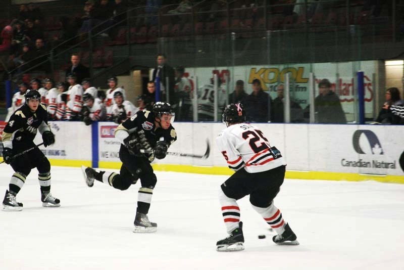 Pontiacs forward Eric Peterson launches a shot from the top of the circle during the game against Lloydminster Saturday. The Pontiacs beat the Bobcats 2-0.